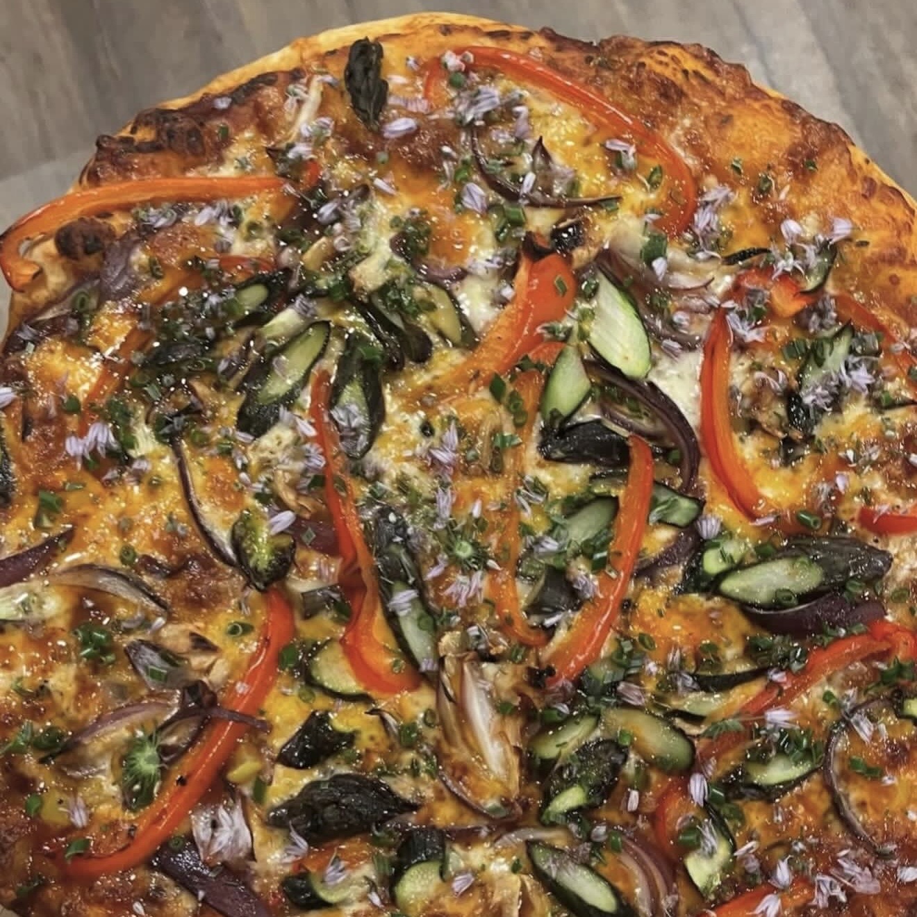 Colorful garden vegetable pizza